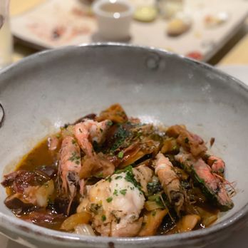 Hot and Hot Fish Club signature dishes Hot and Hot Shrimp and Grits, Tomato Salad with Fried Okra and Smoked Bacon, and Seared Scallops.